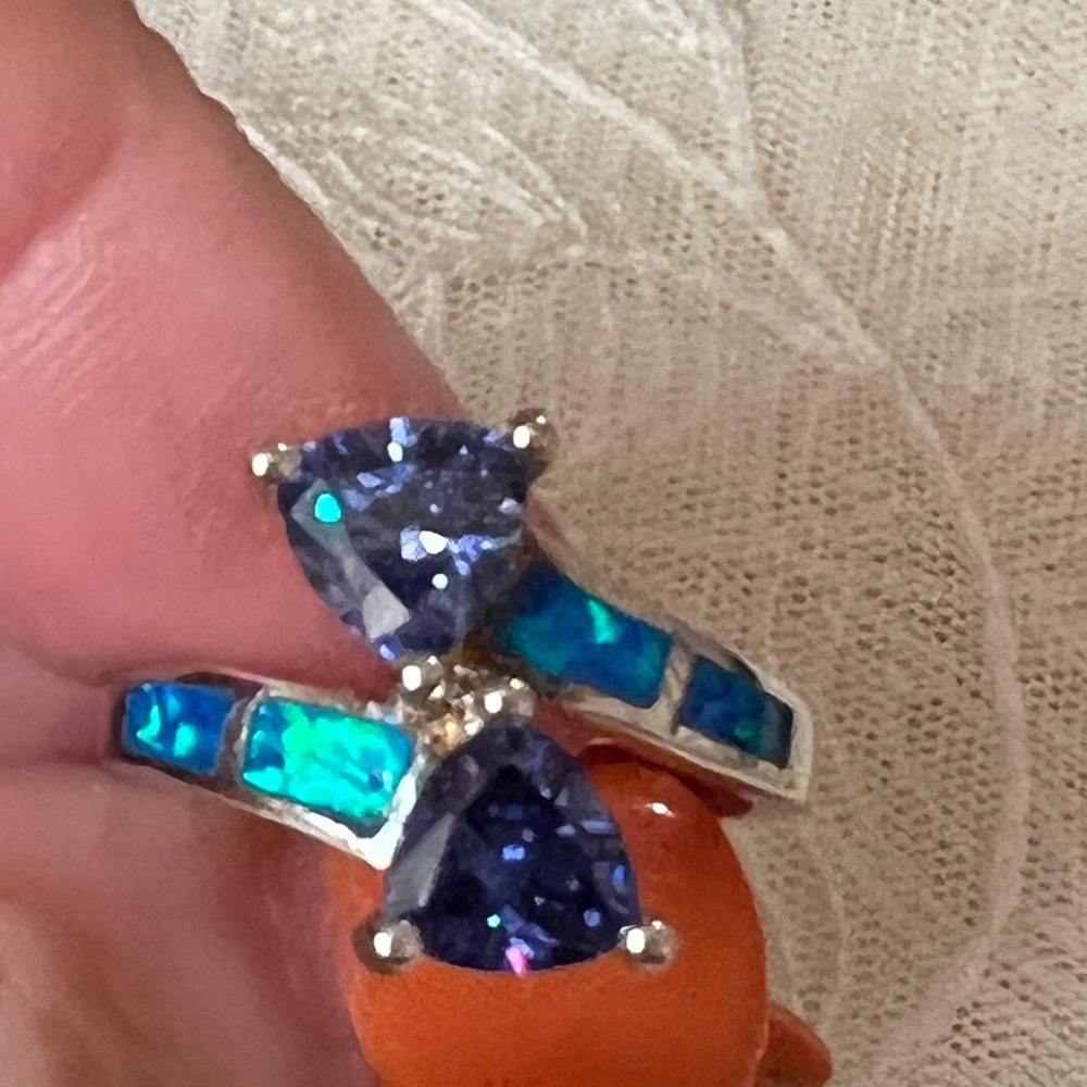 Beautiful Tanzanite and inlaid opal.  Sterling silver setting